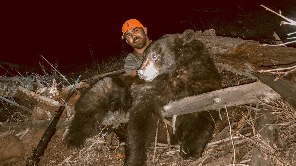 Jaden Bales with his 2020 spring black bear that he harvested in wyoming